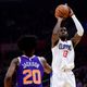 Jamil Wilson, No. 13, of the Los Angeles Clippers scores on a jumper over Josh Jackson, No. 20, of the Phoenix Suns during the first half of a game at Staples Center on Dec. 20, 2017, in Los Angeles. (Harry How/Getty Images)